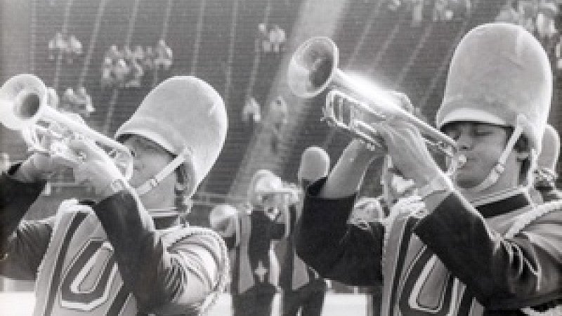 Marching band students playing trumpet